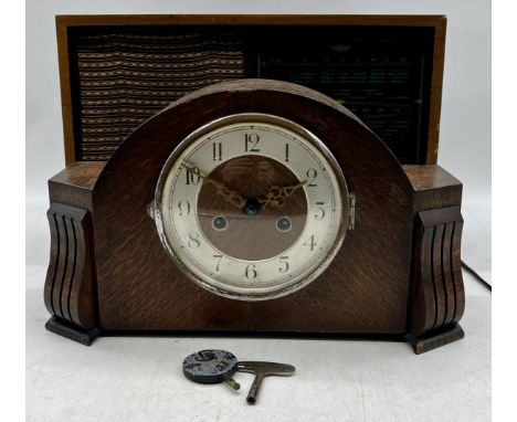 A vintage Kolster-Brandes radio along with a mantle clock