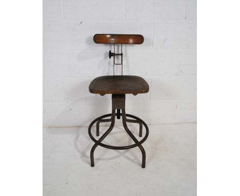 A vintage industrial 'Evertaut' machinists swivel stool with adjustable back rest