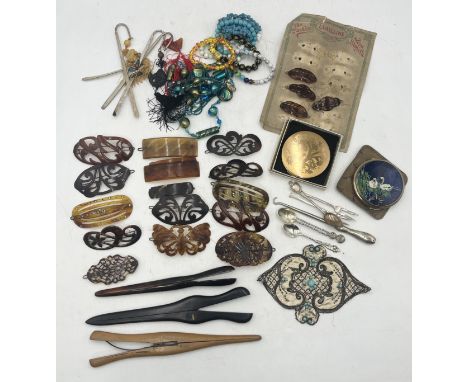 A collection of items including vintage costume jewellery, hair slides, compacts, glove stretchers etc.