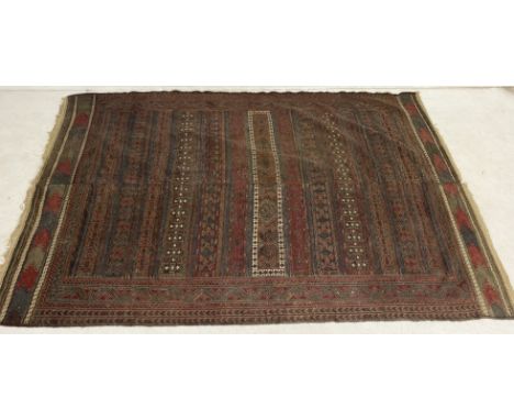 A vintage red ground Eastern rug, possibly Afghan circa 1920's, 9ft 2 x 6 ft. Made in two halves and stitched lengthwise