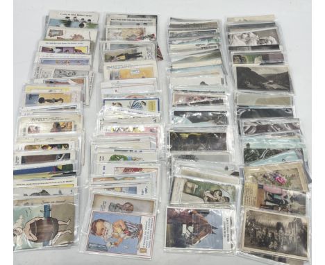 A collection of vintage postcards including a number of comic examples