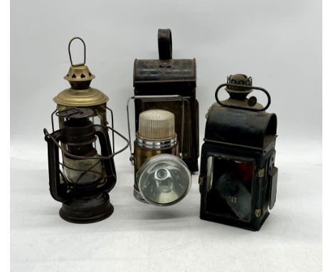 A collection of vintage lamps including a kerosine and railway lamp etc