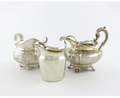 A small collection of three antique silver cream jugs, comprising: one by Reily and Storer, London 1837, circular bellied for