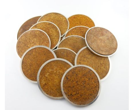 A set of twelve modern silver rimmed cork place mats, and a serving mat, maker's mark of R R in two punches, Sheffield 1973, 