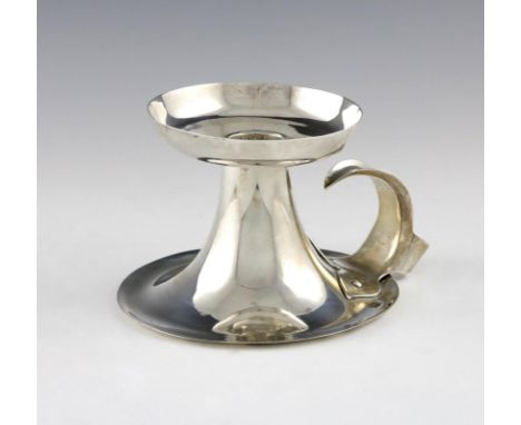 An Edwardian silver Arts and Crafts chamber stick, by Thomas Bowley, London 1901, raised circular form, riveted strap work sc