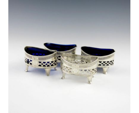 A set of four George III silver salt cellars, by Thomas Lamborn, Sheffield 1801, oval form, pierced and engraved decoration, 