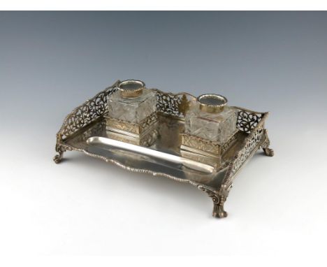 A presentation regimental silver inkstand, by William Hutton and Sons, London 1909, rectangular form, pierced foliate gallery
