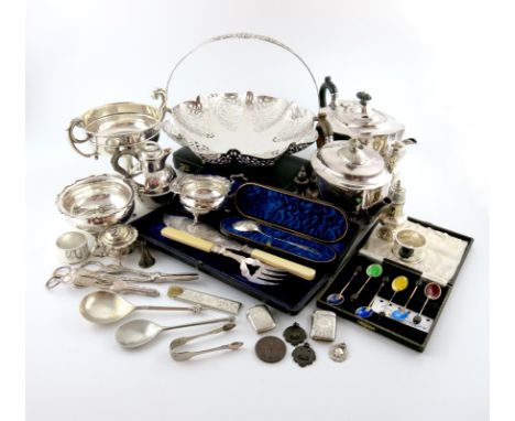 λ A mixed lot, comprising silver items: a two-handled trophy cup, Birmingham 1915, a cream jug and sugar bowl, a candlestick,