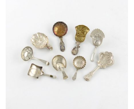 λ A collection of nine silver caddy spoons, various dates and makers, including ones of shovel form, pierced handled, the bow