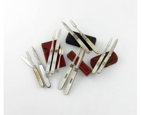 A collection of silver fruit knives and forks, comprising: a George III fruit knife and fork, with a small spoon, by Thomas W