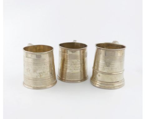 Three regimental silver mugs, by Mappin and Webb, London 1913, William Hutton and Sons, Birmingham 1927, and one by The Barna