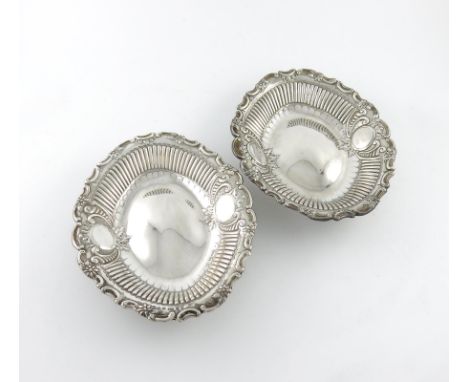 A pair of late-Victorian silver dishes, by Elkington and Co, Birmingham 1891, oval form, part fluted decoration, foliate scro