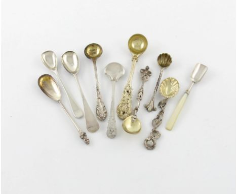 A collection of ten silver condiment spoons, comprising: a Victorian silver-gilt ladle, by George Adams, London 1841, foliate