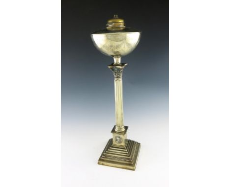 A late-Victorian electroplated oil lamp, Corinthian column form, with a circular oil holder, engraved foliate decoration, on 