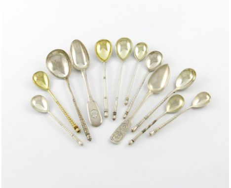 A collection of twelve Russian silver spoons, including a silver-gilt and niello work teaspoon, the reverse of the bowl with 