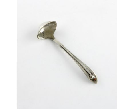 λ By Georg Jensen, a Danish silver cream ladle, design no. 5, circa 1915-32, the terminal with applied foliate motif and cora