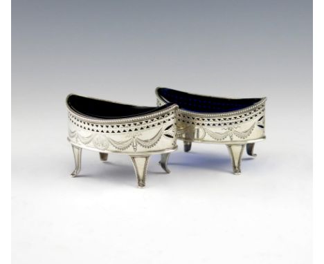 A pair of George III silver salt cellars, by William Abdy, London 1787, oval navette form, beaded borders, pierced and engrav