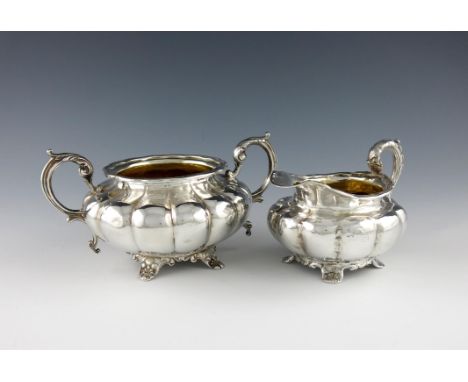 A Victorian silver two-handled sugar bowl, by The Goldsmiths and Silversmiths Company, London 1895, lobed circular form, leaf