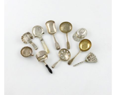 A collection of ten silver caddy spoons, various dates and makers, including: one with a mother-of-pearl handle, one of shove