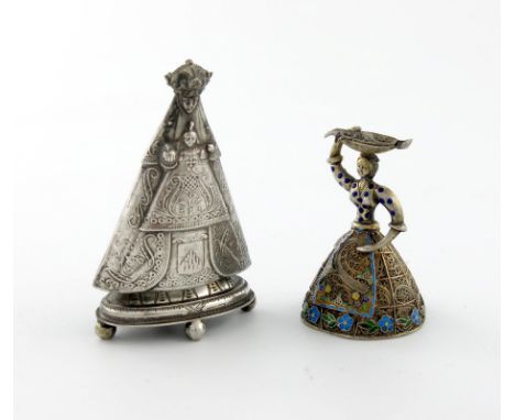 A continental silver and enamel model of a lady carrying a basket, unmarked, the filigree dress with enamelled decoration, th