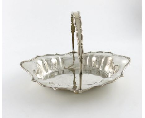 A silver swing-handled basket, by William Hutton and Sons, Sheffield 1910, shaped oval form, on four bun feet, length 32cm, a