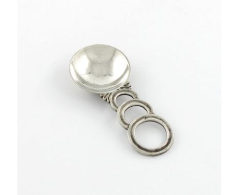 By Charles Boyton, an Art Deco silver caddy spoon, London 1938, also signed Charles Boyton, circular spot-hammered bowl, the 