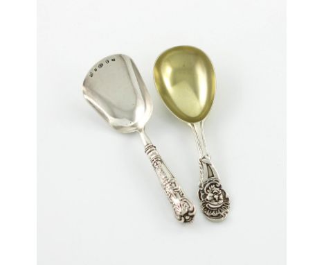 A Victorian silver-gilt caddy spoon, by Henry Holland, London 1869, the terminal with a mask, plus a King's pattern caddy spo