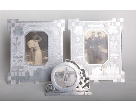 SECOND WORLD WAR - A DECORATIVE PAIR OF AIRCRAFT ALUMINIUM 'TRENCH ART' PHOTOGRAPH FRAMES  engraved with flowers and Middle E