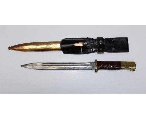 A Second War German K98 brass mounted dress bayonet and scabbard. The 25cm blade numbered 1404. 38cm total length