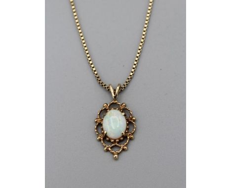 A 9ct gold opal foliate pendant on a 9ct gold box chain. The drop is 2.5cm on the pendant