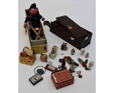 A small mixed lot of collectors items, including Pelham policeman puppet, oak candle box, beadwork needle case, playing cards