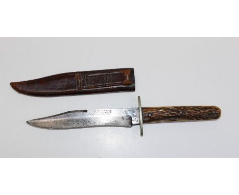 Wostenholm and Son, a small, late 19th century Bowie-type knife with stag horn grip. 24cm total length, in a stitched leather