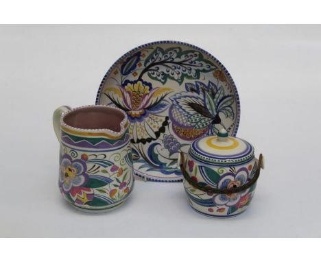 Ethel Barrett, a circa 1930's Poole Pottery biscuit barrel and cover, brightly decorated with geometric and floral forms, 16c