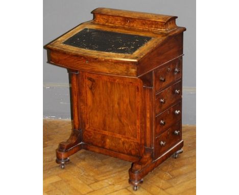 A Victorian walnut, burr walnut crossbanded and strung Davenport desk, domed stationary compartment and fitted interior, over