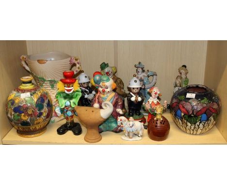 A mixed lot of decorative 20th century ceramics, to include an Italian earthenware lamp base, clown money box, Murano clown, 