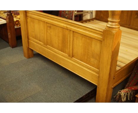 A light oak full tester bed, with Wainscot panelled back and top and turned front posts, 192cm wide.