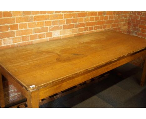 A light oak rectangular office table, 214cm wide, 90cm deep, 75cm high.