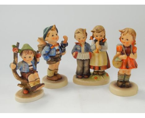 Four Goebel Hummel figures, including Birthday Serenade.