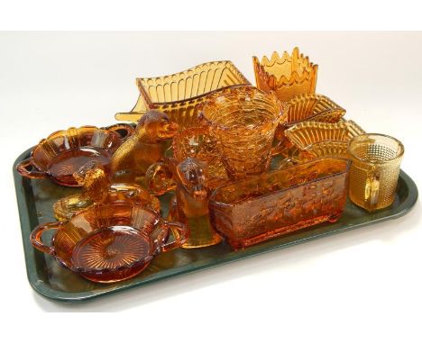 A collection of pressed amber glass vases, and models including a pair of Davison's two handled shallow baskets, Sowerby vase