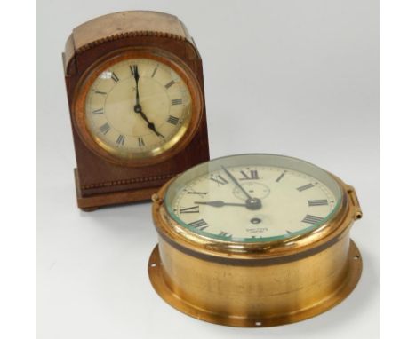 A brass cased bulk head clock by Smiths, 18cm diameter, and a H A C mahogany cased mantel clock, 18cm high, (2).