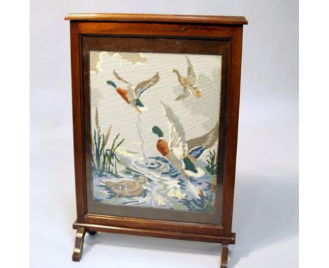 A 1920's mahogany firescreen, with wool work panel of Mallards.