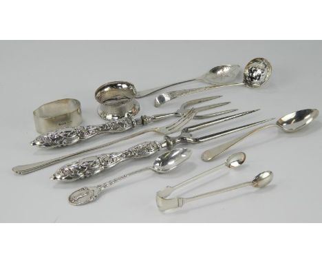 A steel three pronged bread fork, with embossed silver handle and another steel two pronged fork with matching embossed silve