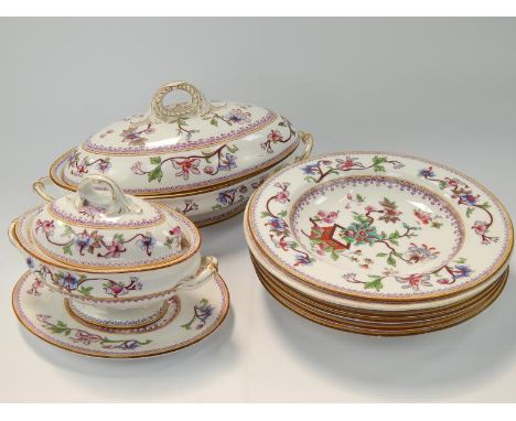 A Royal Worcester dinner service, decorated in polychrome with Chinese flowering branch decoration and with gilt outlines, in