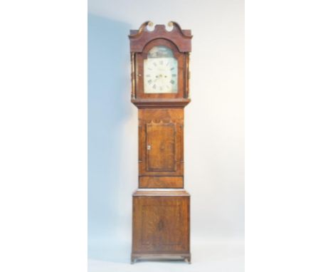   A George IV oak longcase clock, with inlaid hood with pillared decoration, case having door with central cartouche leading 