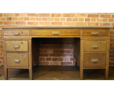 A light oak pedestal desk, 152cm x 92cm.
