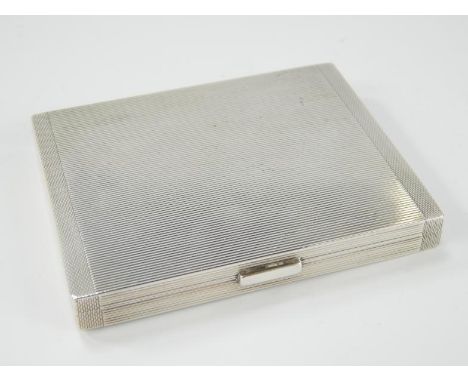 A late George VI rectangular silver case, with reeded and engine turned decoration and gilt interior, Birmingham 1936, 3oz.