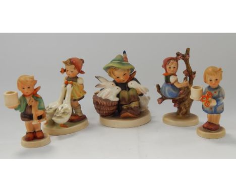 Five Goebel Hummel figures.