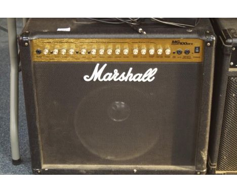 A Marshall MG series 100DFX guitar amplifier, with single 12" speaker and channel changing foot switch.