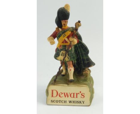 A Dewar's Scotch Whisky advertising figure, of a Highland bandsman.