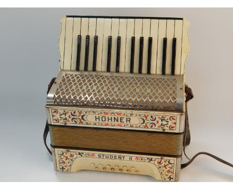 A Hohner Student II piano accordion, in original case.